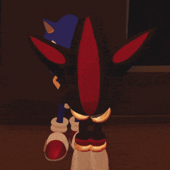 shadow the hedgehog and sonic the hedgehog are standing next to each other
