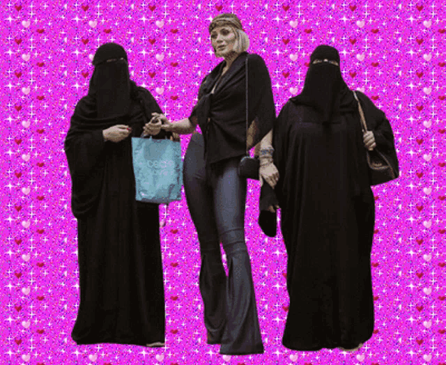 a woman in a niqab stands next to two other women