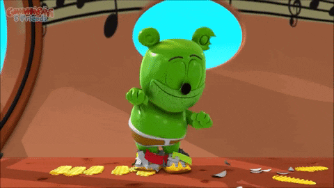 a green gummy bear is standing in front of a window that says gummy 's friends on it