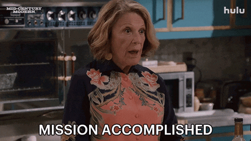 a woman says mission accomplished in front of a hulu sign