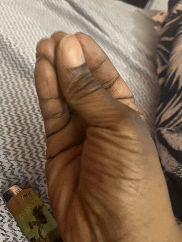 a person holding a lighter that says bic fearless on it