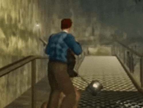 a man in a blue jacket is running down a set of stairs .