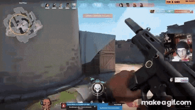 a man is holding a gun in front of a screen that says make a gif.com on it