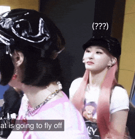 two girls are standing next to each other with the words at is going to fly off at the top