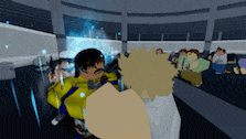 a group of people are playing a video game in a dark room