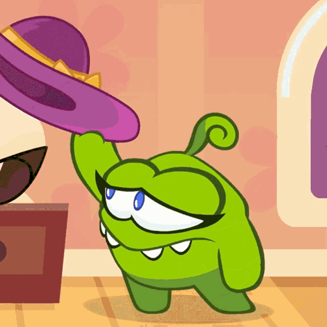 a green cartoon character is holding a purple hat in his hand