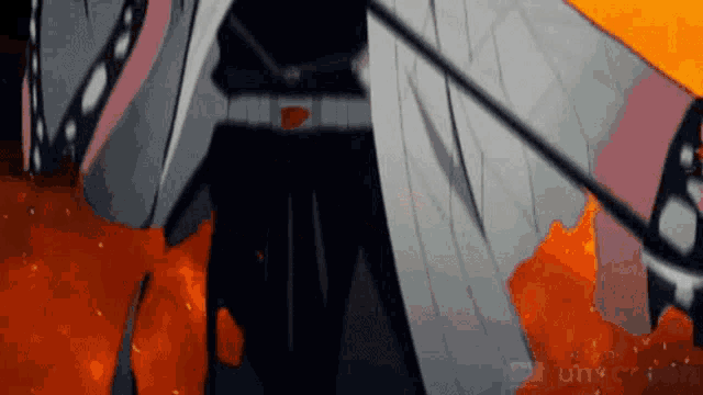 a person is standing in a room with a sword in their hand .