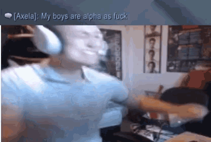 a man wearing headphones is dancing in a room with the words " my boys are alpha as fuck " below him