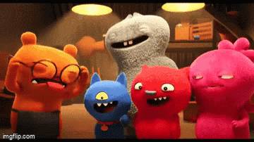 a group of stuffed animals standing next to each other