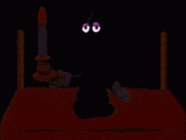 a cartoon character is holding a candle in a bed