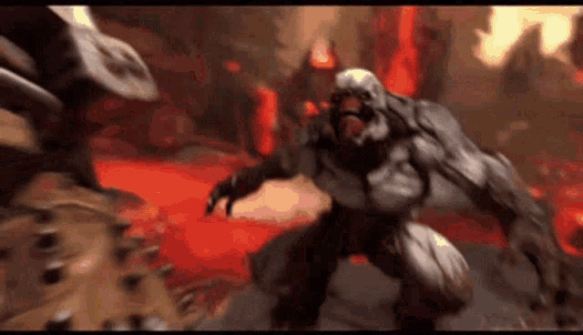 a monster is fighting another monster in a video game in a lava pit .