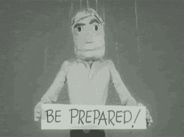 a puppet holds a sign that says be prepared