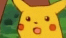 a close up of a cartoon pikachu with its mouth open .