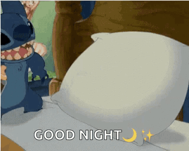 a cartoon of stitch standing next to a pillow with the words good night