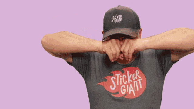 a man wearing a shirt that says sticker giant