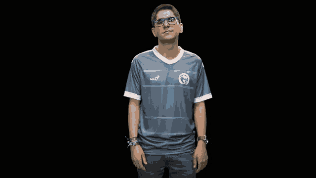 a man wearing glasses and a shirt that says ' aoa ' on it