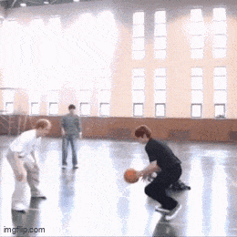 a group of people are playing basketball in a gym with imgflip.com in the corner