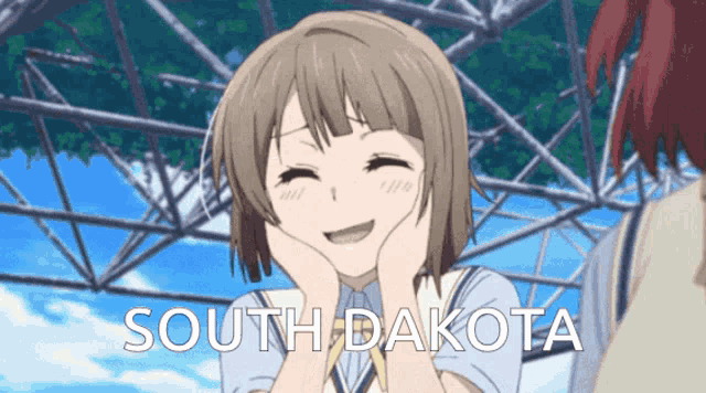 a girl with her hands on her face is smiling with the words south dakota below her