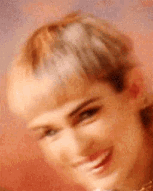 a close up of a person 's face with a pink background