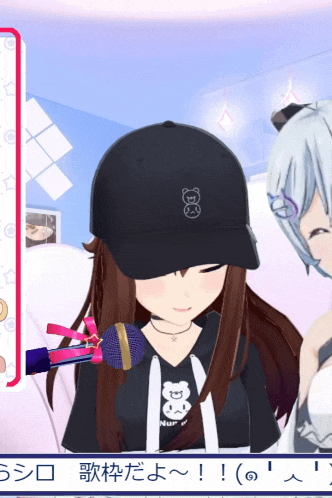 a girl wearing a black hat and a shirt that says nur on it is talking into a microphone