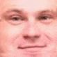 a close up of a man 's face with a cat 's ear on it .