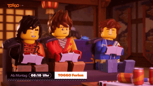 three lego figures are sitting at a table with a sign that says toggo ferien