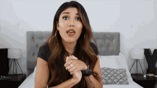 a woman with a tattoo on her arm that says ' i love you ' on it