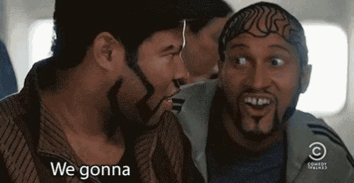 a couple of men are sitting next to each other on a plane .