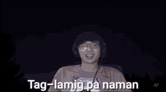 a man wearing headphones and glasses looks at the camera with the words tag-land mama on the bottom right