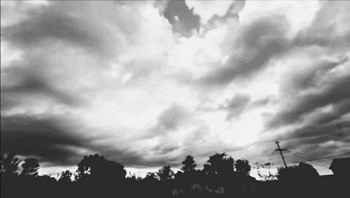 a black and white photo of a stormy sky