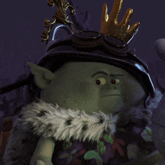 a green troll wearing a helmet and a crown