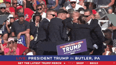 a group of people are gathered in a stadium with a sign that says president trump in butler pa