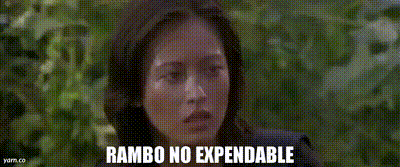 a man in a black tank top is standing in the woods with the words rambo no expendable above him
