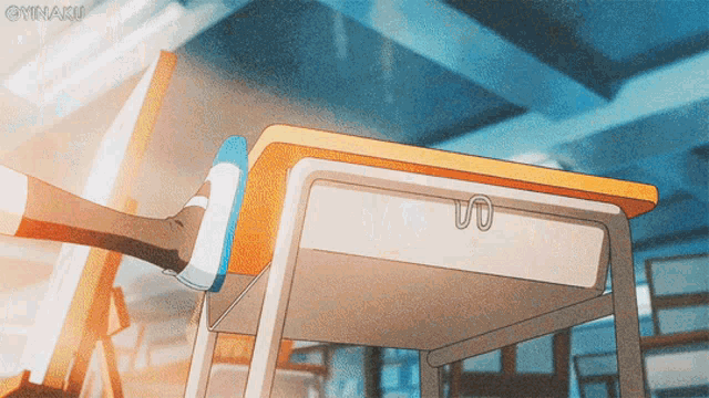 a cartoon drawing of a person 's foot on a desk with a clip on it