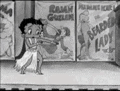 a black and white cartoon of betty boop dancing in front of a row of movie posters .