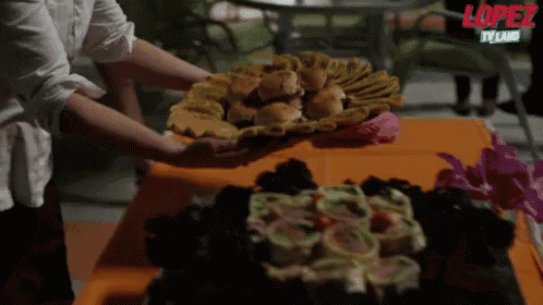 a lopez tv show is being advertised on a table with food