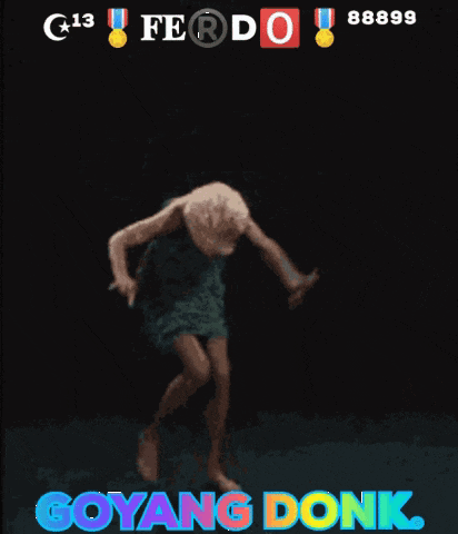 a woman in a green dress is dancing in front of a black background with the words goyang donk on it
