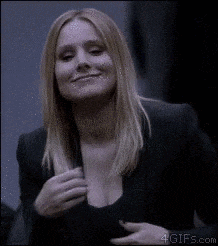 a woman in a black jacket is giving the middle finger .