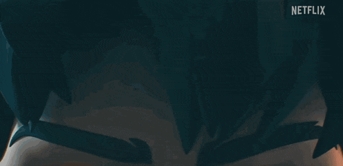 a close up of a cartoon character 's eyes with fire coming out of them