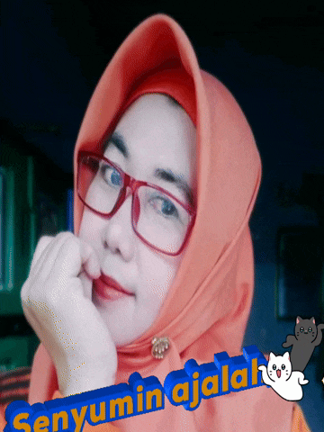 a woman wearing glasses and a hijab with the words senyumin ajala on the bottom right