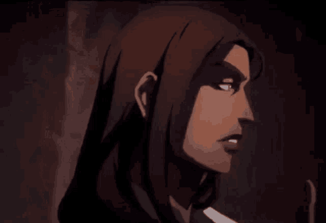 a close up of a woman 's face in a dark room .
