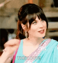a woman in a blue and purple sari is talking to someone and saying `` they out ! ''