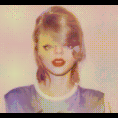 a close up of a woman 's face with a purple shirt