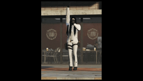 a woman in a white suit stands in front of a fib store