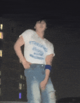 a person wearing a white shirt with the word york on it is dancing