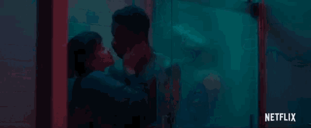 a man and a woman are kissing in a bathroom in front of a netflix logo .