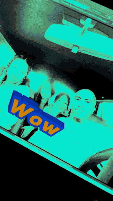 a group of people sitting in a car with the word wow written on it