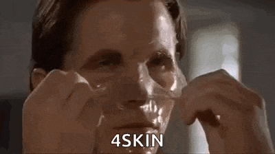 a man is peeling off a piece of tape from his face and says `` 4skin '' .