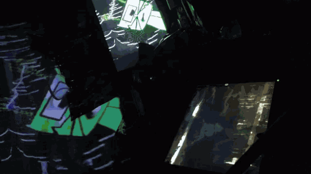 a green box with an eye on it is projected on a screen