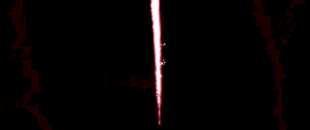 a red light is shining through a dark room